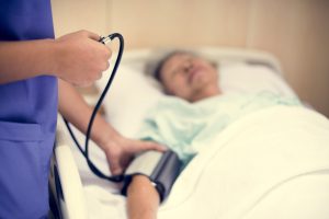 Old woman at lying in a hospital bed